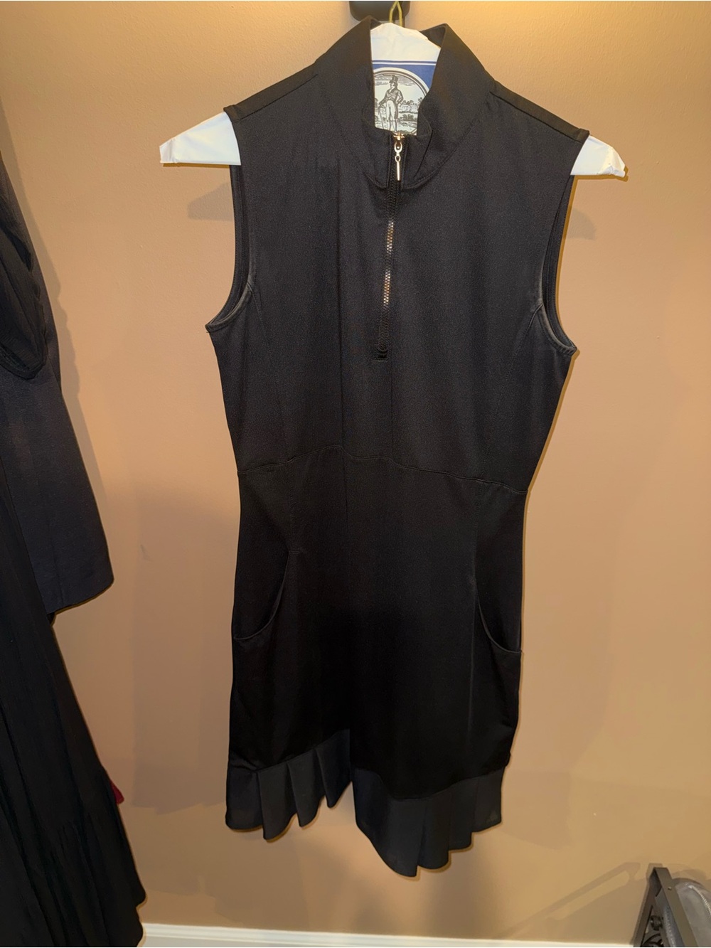 Sleeveless Black Midi Golf Dress with Front Zip and Pleated Hem